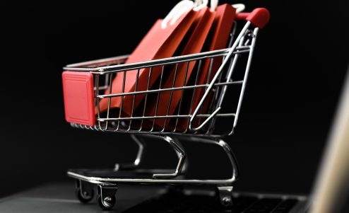 front-view-cyber-monday-shopping-cart-with-bags